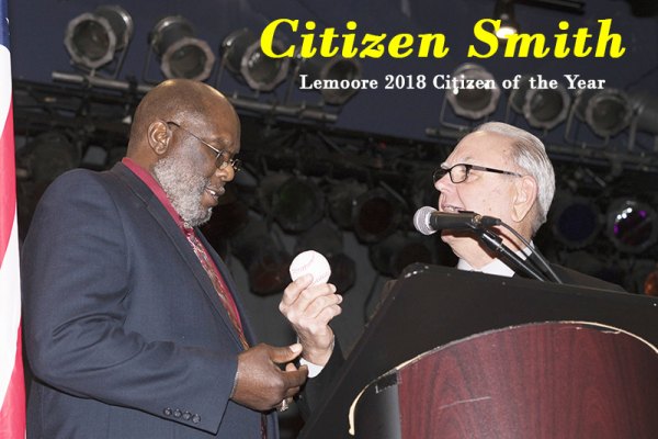 Dr. Ernie Smith accepts the Citizen of the Year Award from last year's recipient Bill Black.